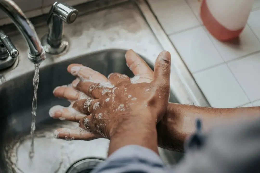 1. Washing and Drying the Dishes by Hand (Image Credits: Unsplash)