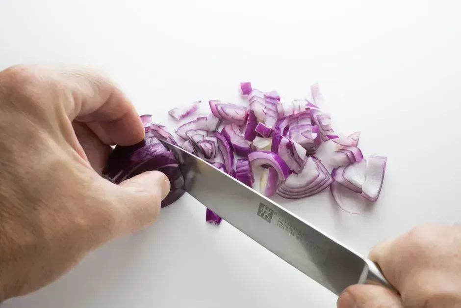 8. Cutting onions from the wrong end (Image Credits: Pexels)