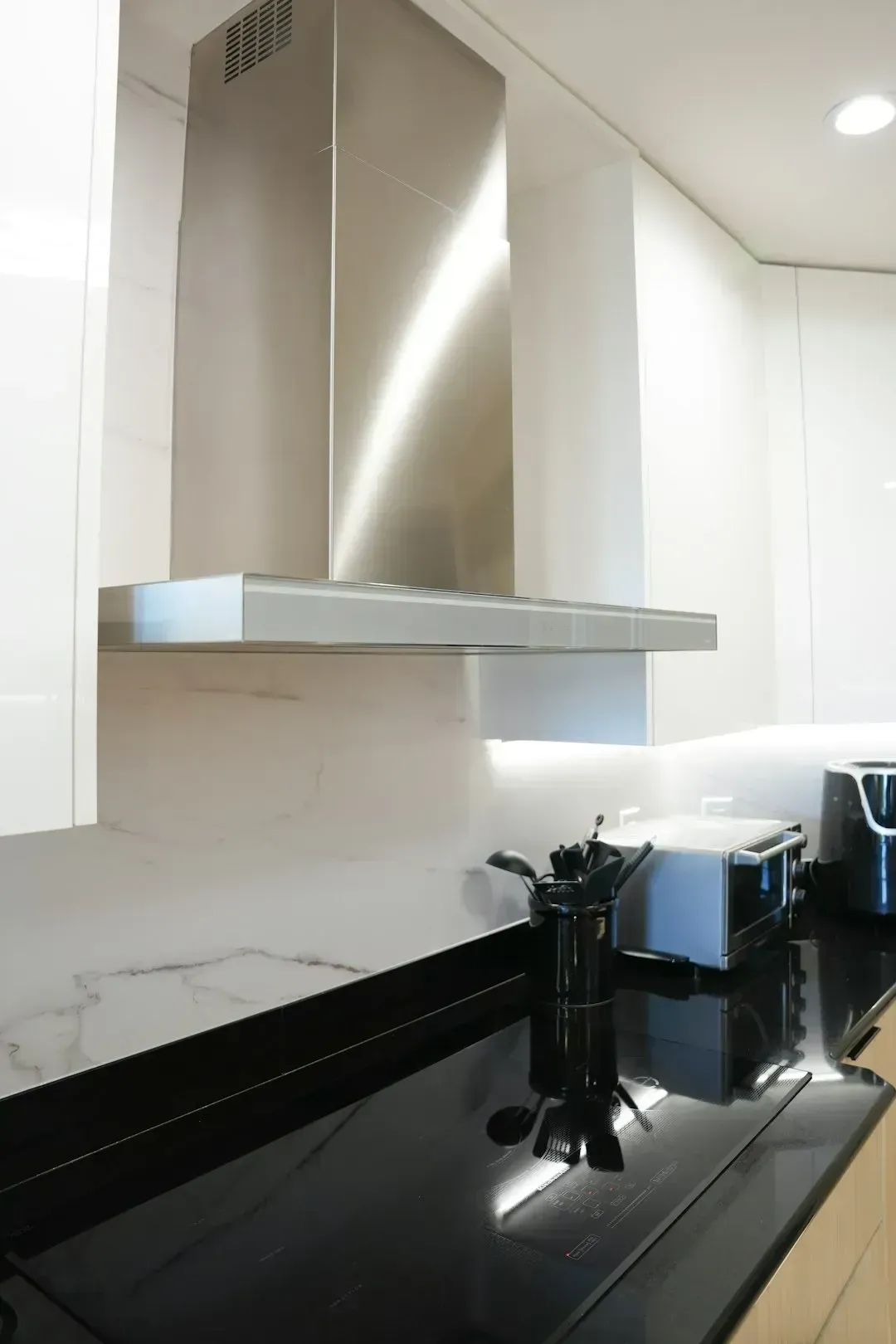8. Running the exhaust fan or range hood during and after cooking (Image Credits: Unsplash)