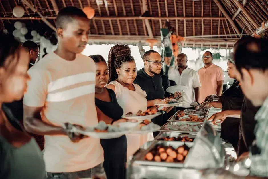 6. Cutting the line or reaching across other guests (Image Credits: Pexels)