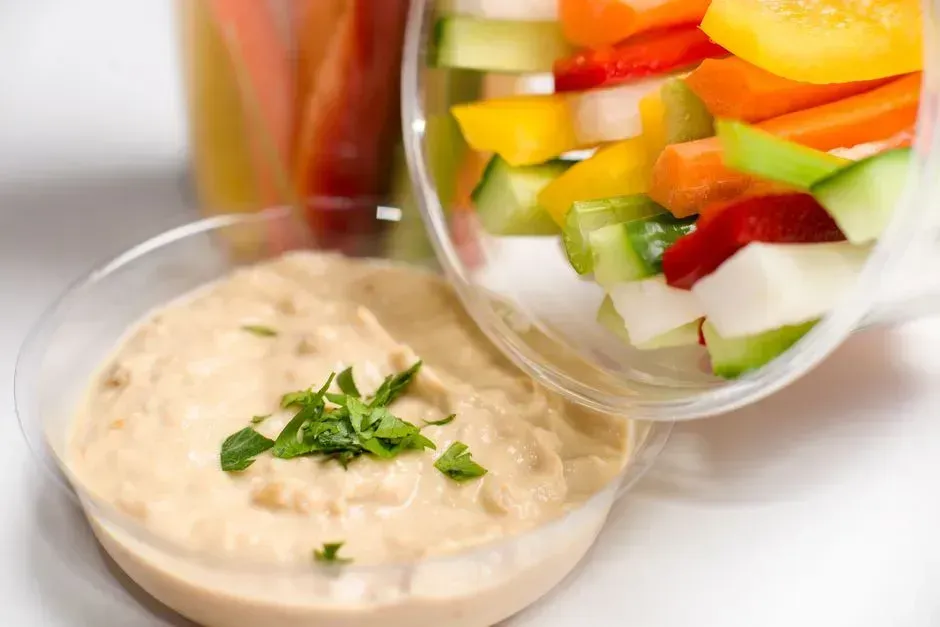 Hummus with cucumber and bell pepper slices (Image Credits: Pexels)