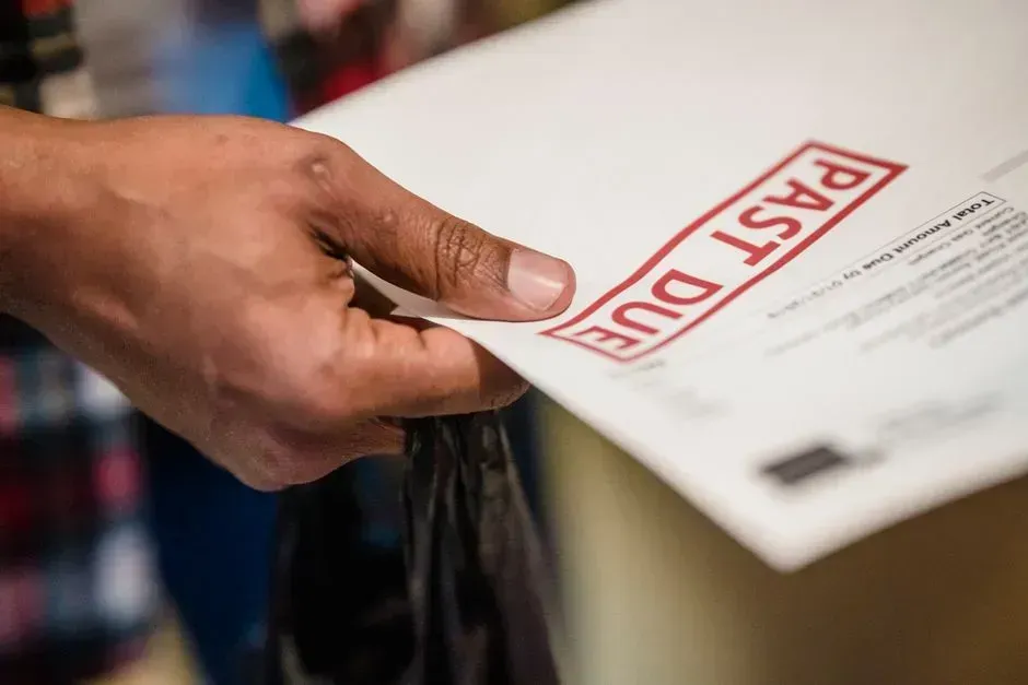 HOA dues, liens, and unpaid bills can transfer with the property (Image Credits: Pexels)