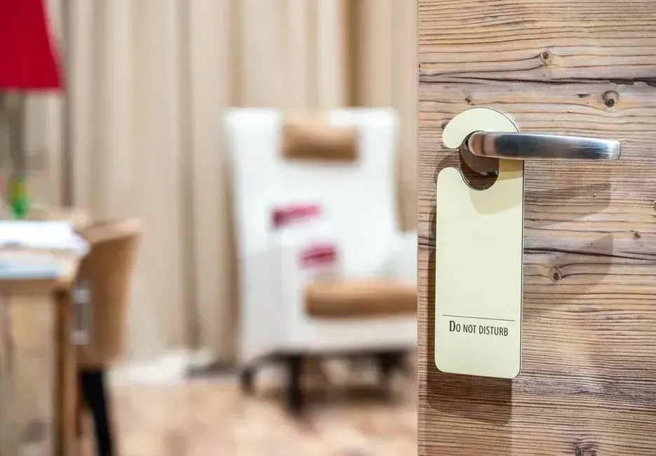 6. Misusing the Do Not Disturb Sign (Image Credits: Pexels)