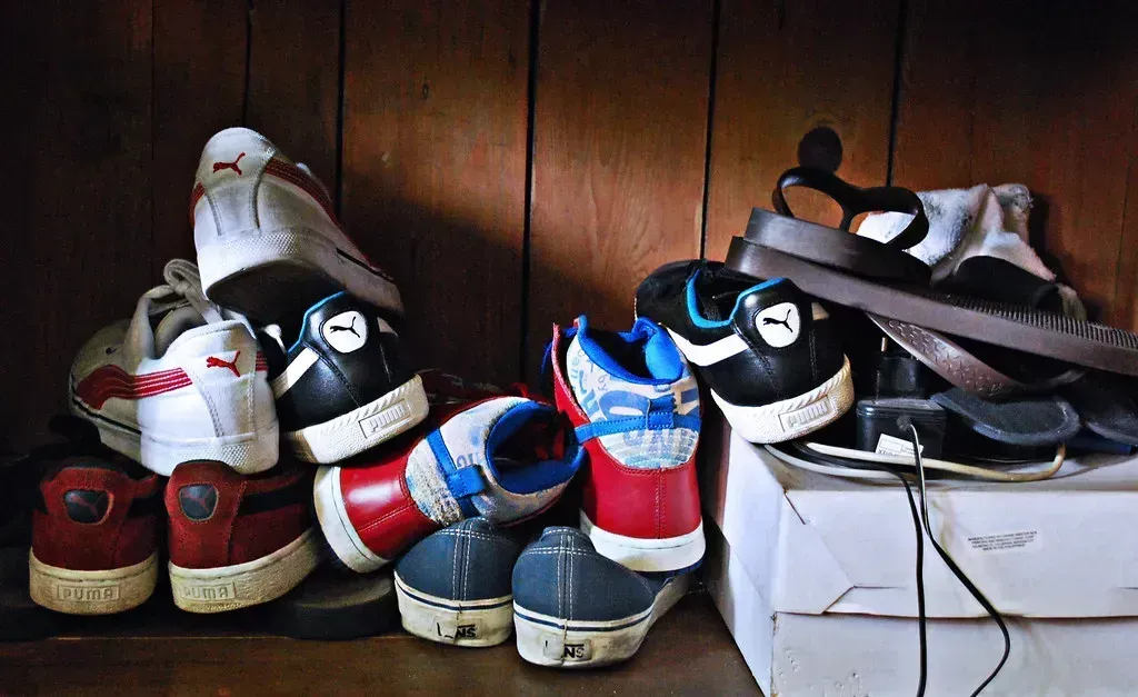 2. Excess Shoes Piled on the Floor (gabohalili, Flickr, CC BY 2.0)