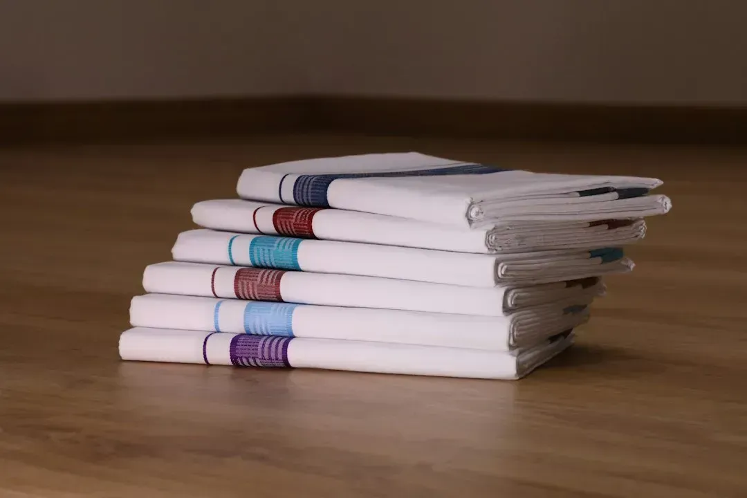 1. A stack of ironed handkerchiefs (Image Credits: Unsplash)