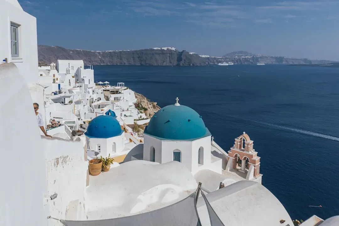 Santorini, Greece: postcard views with a population that can't keep up (Image Credits: Unsplash)