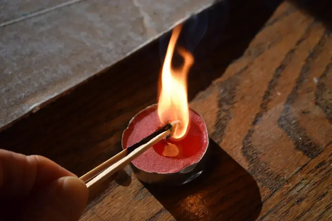 6. Using Candles or Charcoal Grills Indoors for Heat or Light (Image Credits: Unsplash)