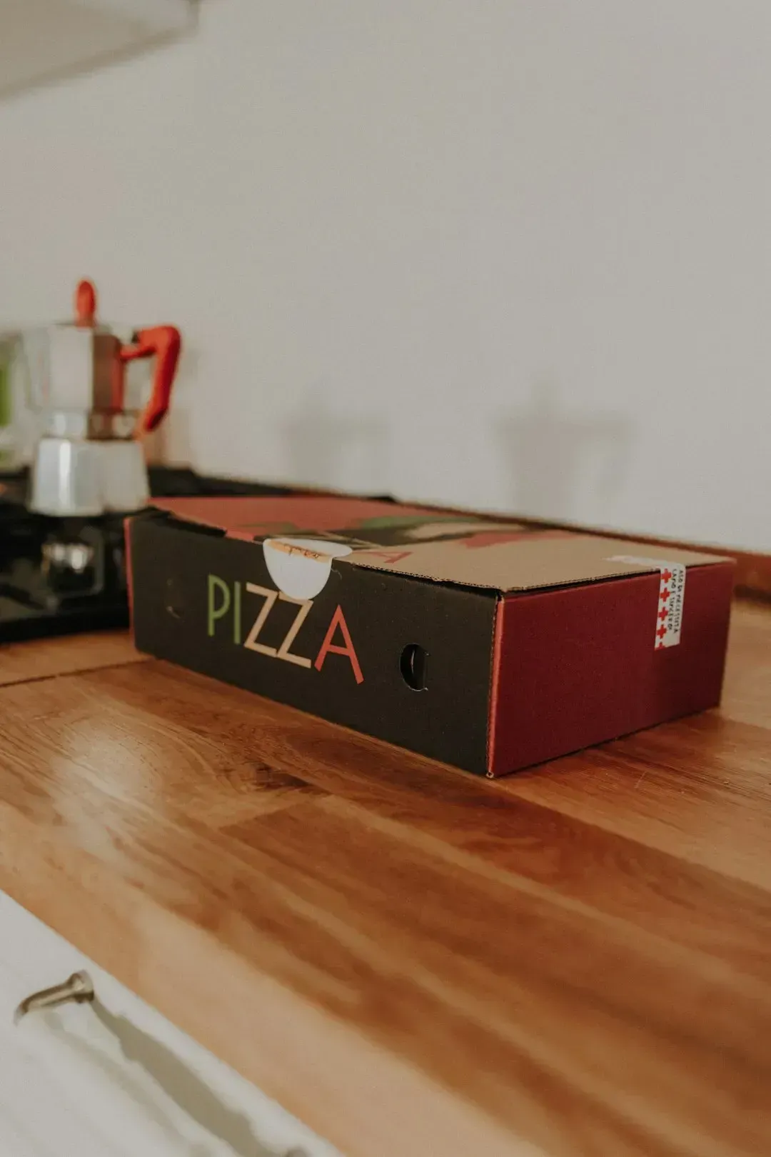 2. Greasy Pizza Boxes (Image Credits: Unsplash)