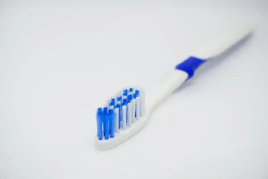 2. Using a Hard-Bristled Toothbrush (Image Credits: Pexels)