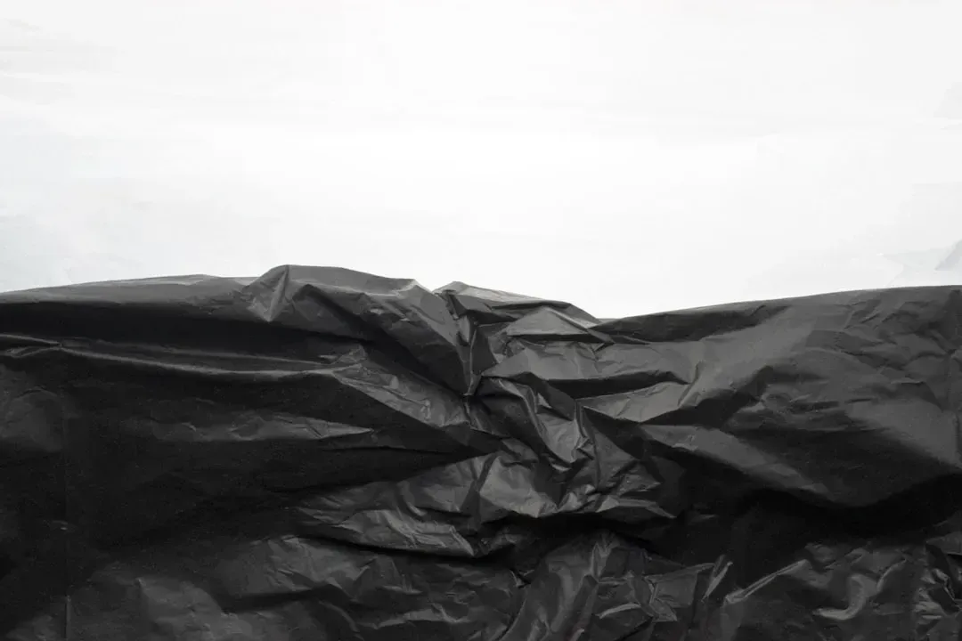 6. Black Plastic Packaging (Image Credits: Unsplash)