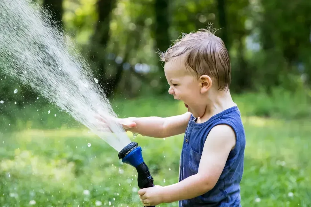 14. Letting Toddlers Drink From Garden Hoses (Image Credits: Unsplash)