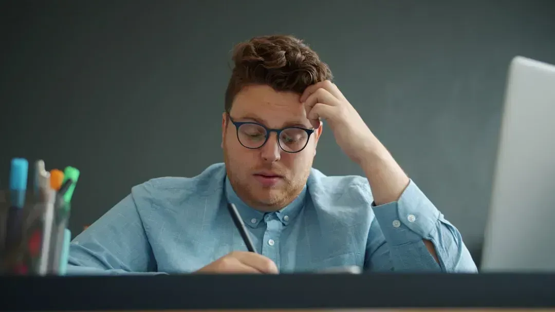 3. He's Checked Out at Work but Still Showing Up (Image Credits: Unsplash)