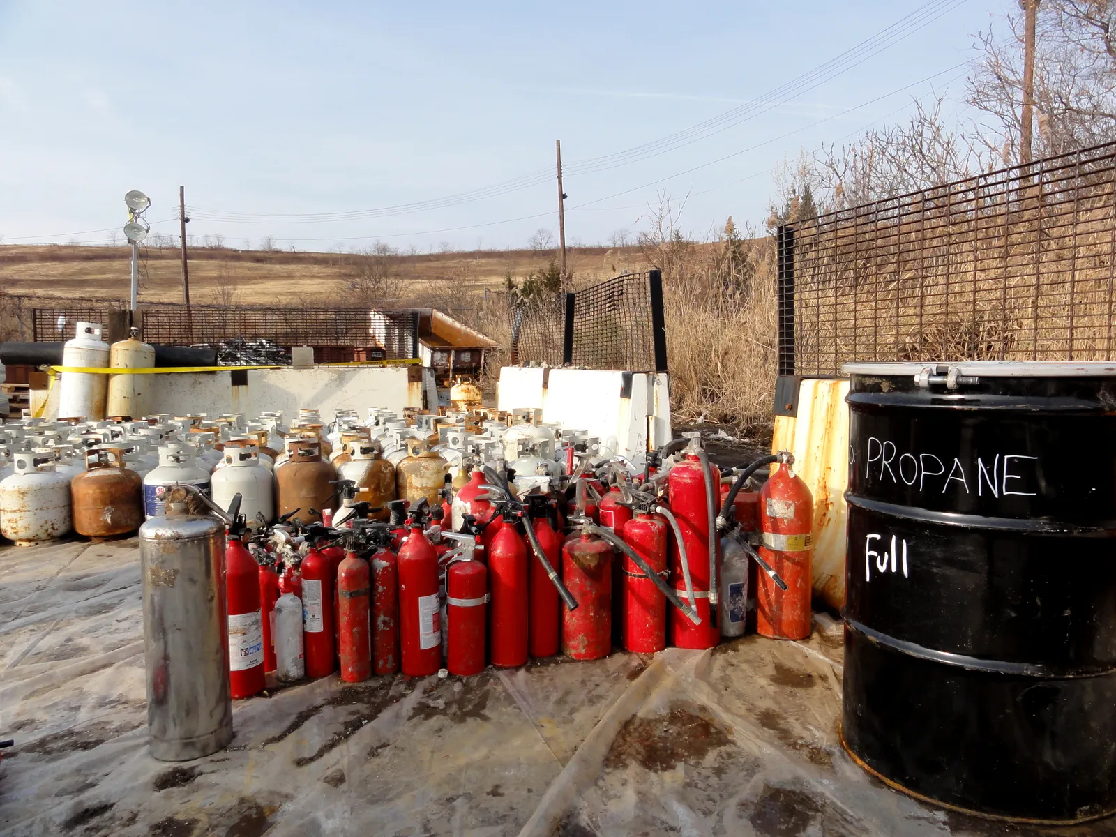 What the Scale of the Problem Actually Looks Like (December 2, 2012 - Fire extinguishers, propane tanks organized for disposal., Public domain)