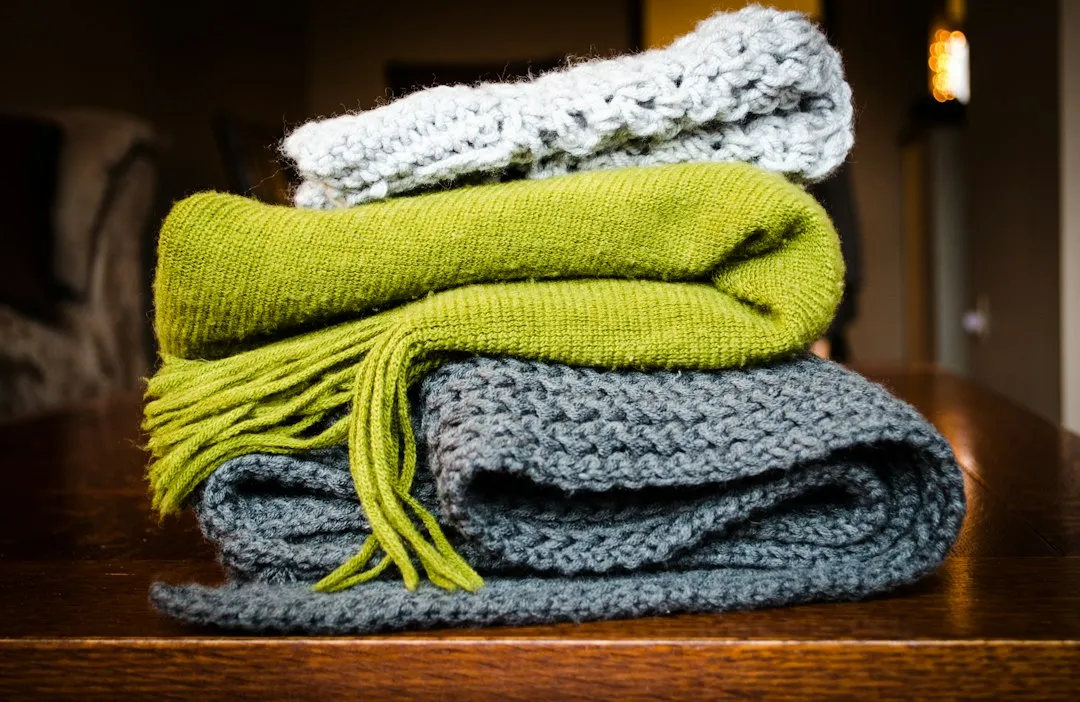 3. Warm Blankets and Extra Clothing (Image Credits: Unsplash)