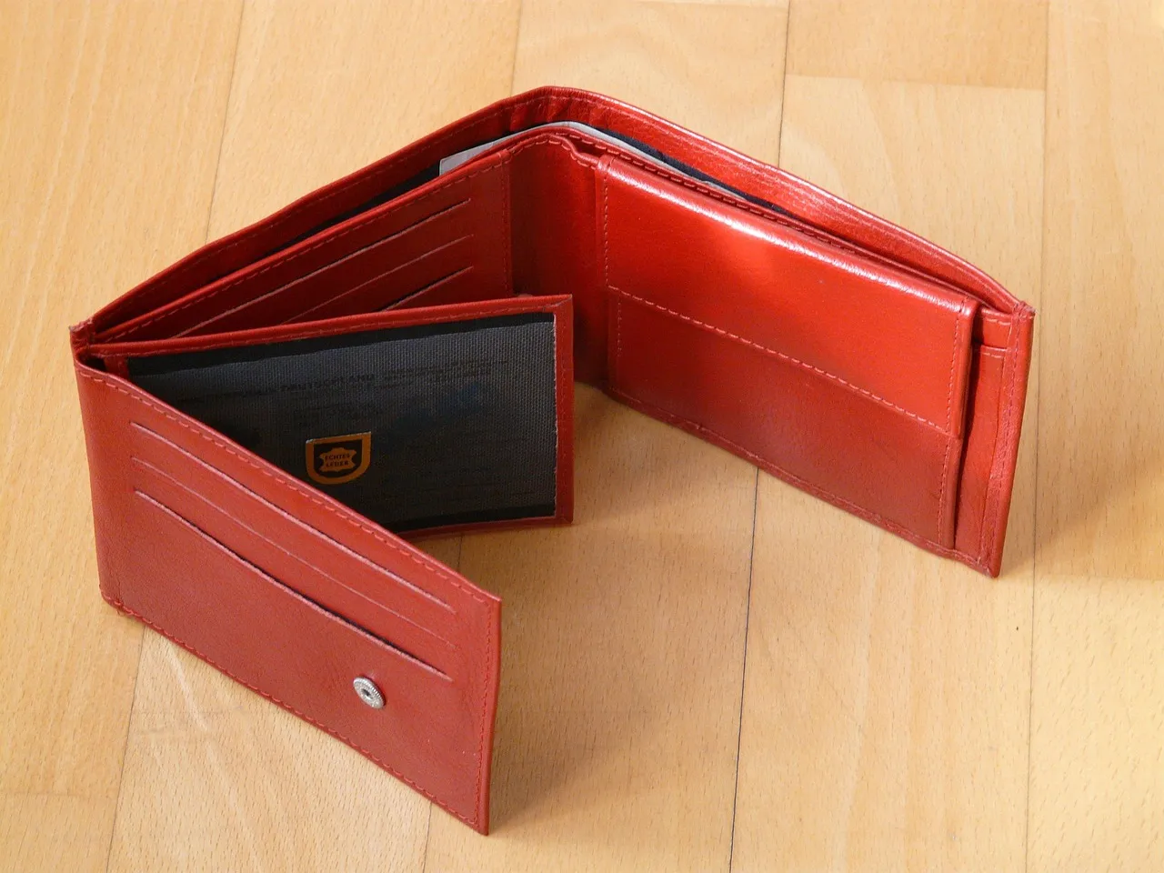 A Red Leather Wallet Full of Secrets (Image Credits: Pixabay)