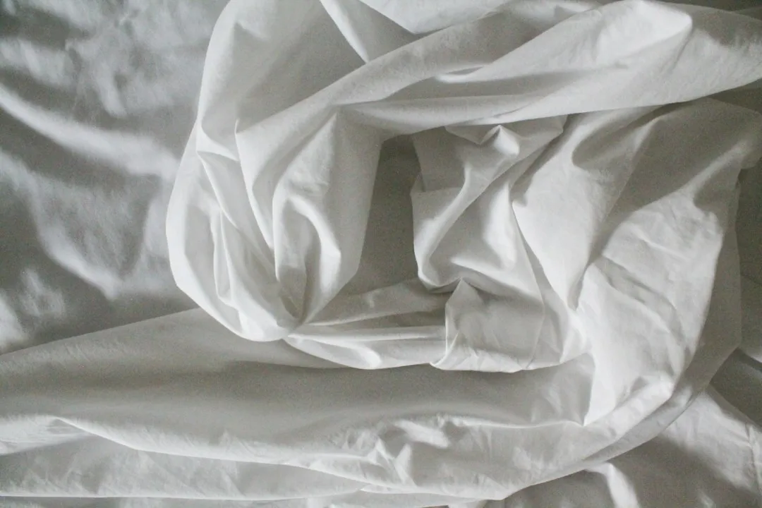 What a Top Sheet Actually Is (and Why It Exists) (Image Credits: Unsplash)
