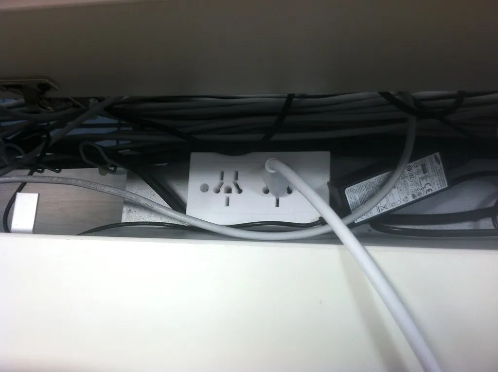 The Bedroom Outlet Buried Behind Furniture (alexfiles, Flickr, CC BY-SA 2.0)