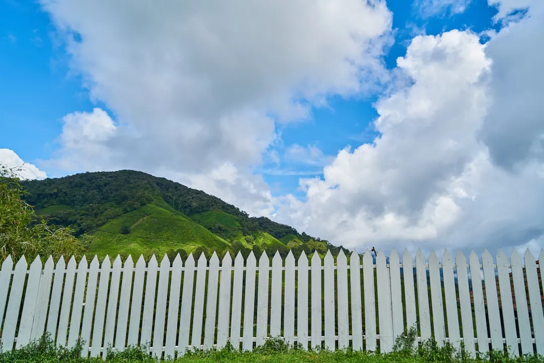 Measuring Fence Height Incorrectly on Sloped Land (Image Credits: Unsplash)