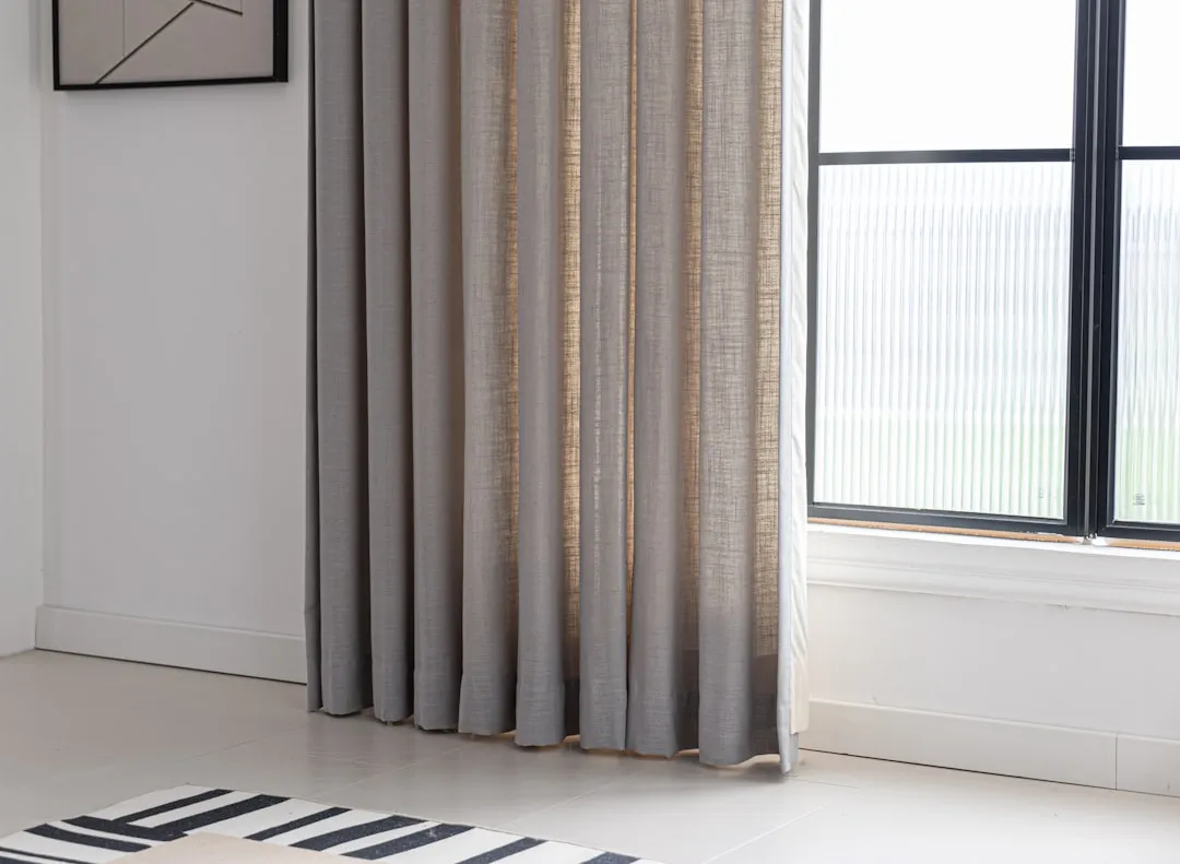 Add Thermal Curtains or Window Coverings (Image Credits: Unsplash)