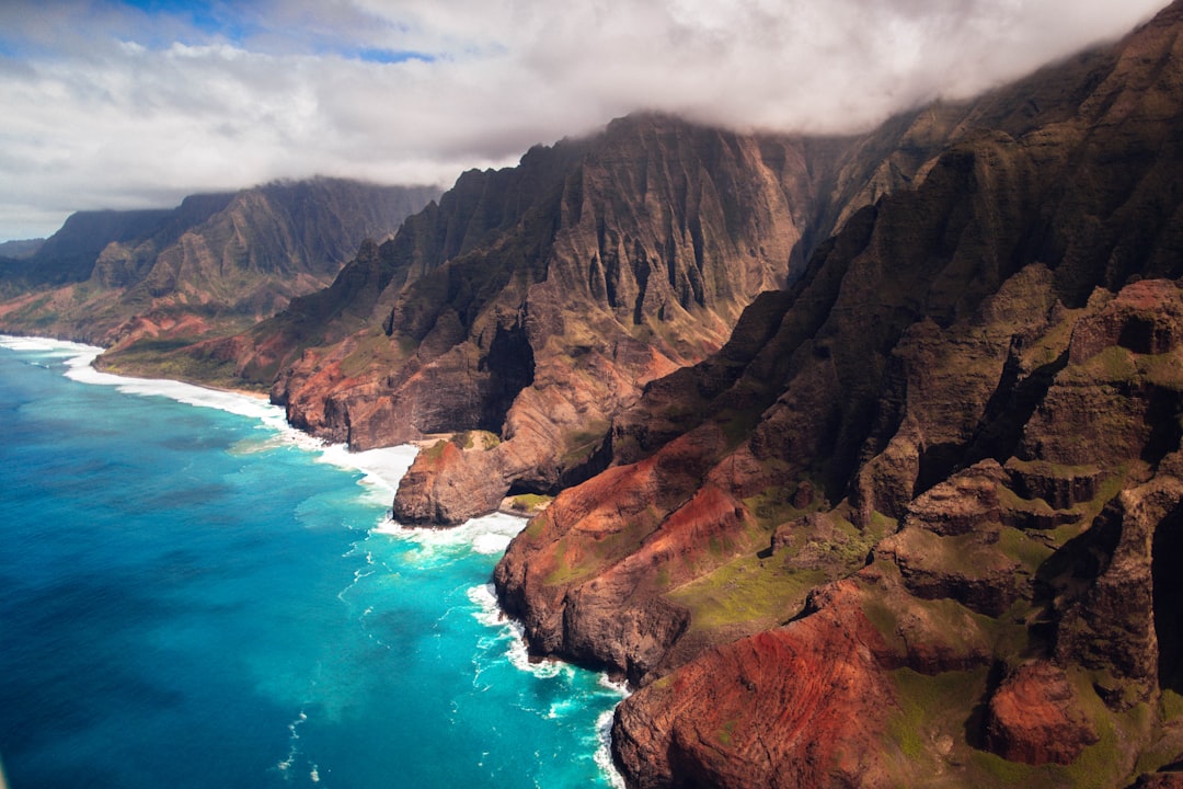 Helicopter Over Kauai’s Nā Pali Coast (Image Credits: Unsplash)