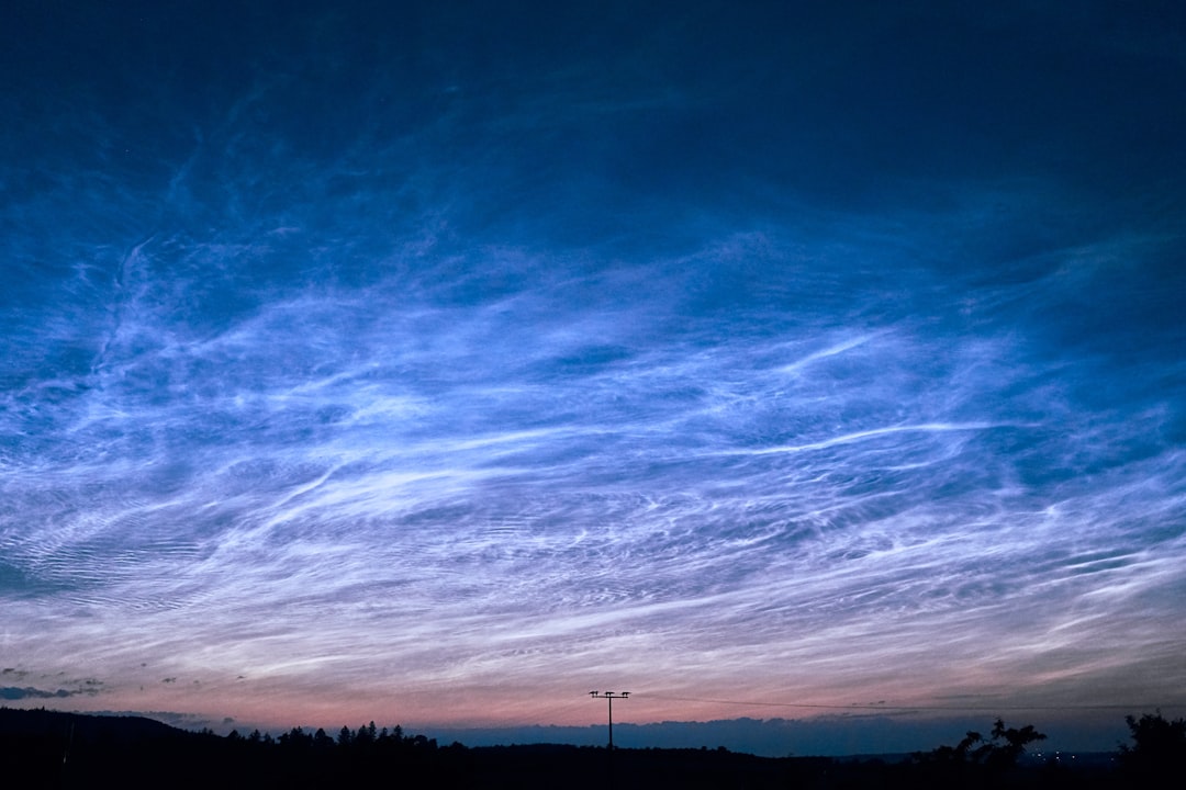 Noctilucent Cloud Photography: Chasing Shimmering Mysteries (Image Credits: Unsplash)