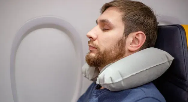 4. A Good Travel Neck Pillow: Save Your Spine (Image Credits: Flickr)