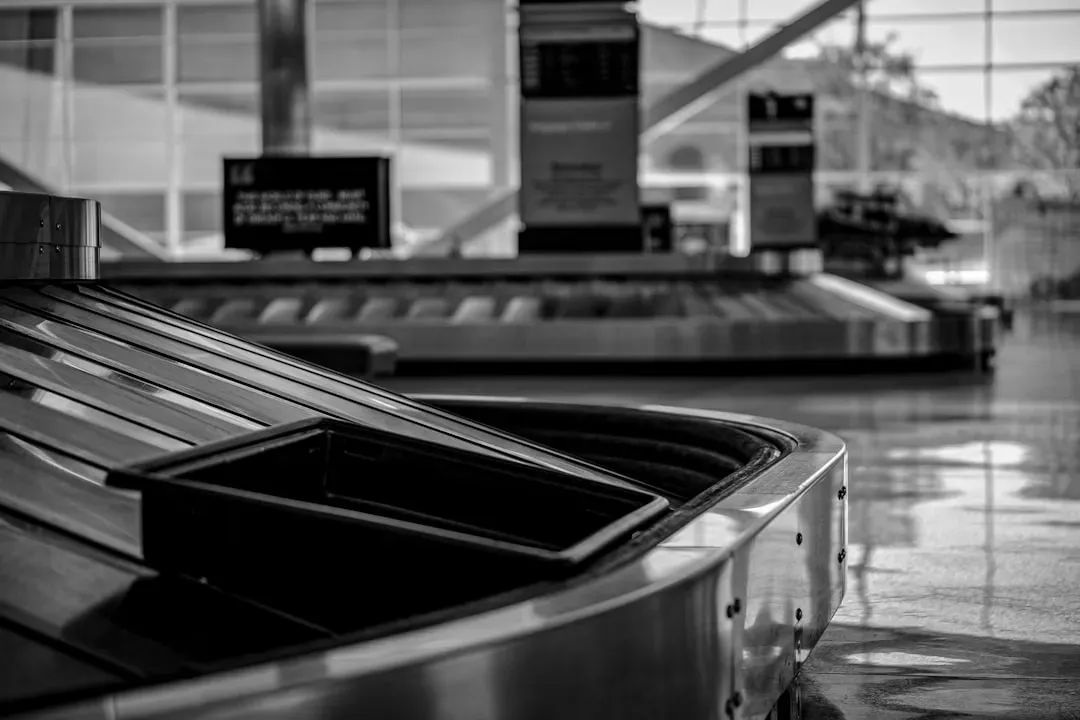 6. Dragging a Luggage Cart Right Up to the Carousel Edge (Image Credits: Unsplash)