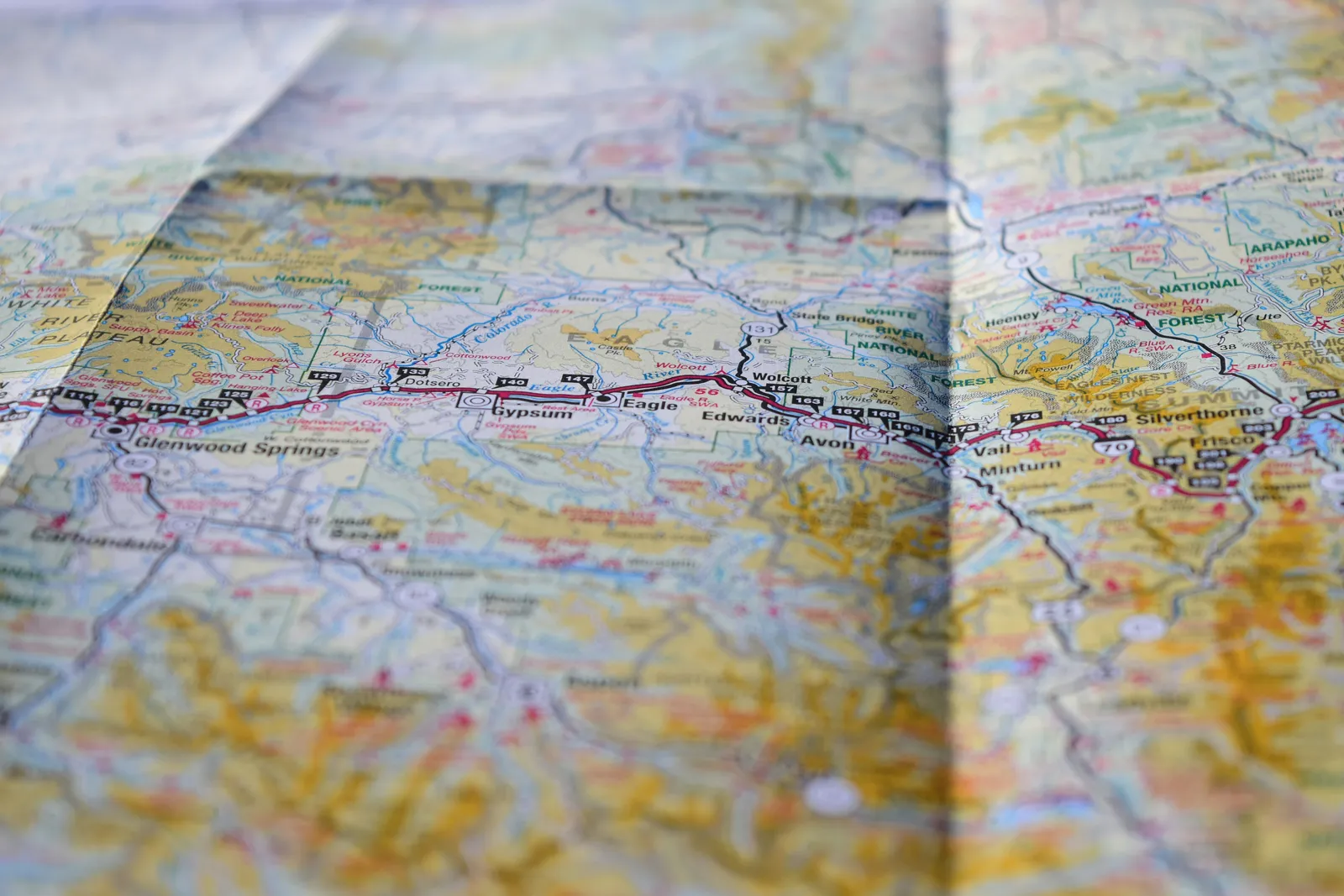 4. A Physical Map or Regional Road Atlas (Image Credits: Unsplash)