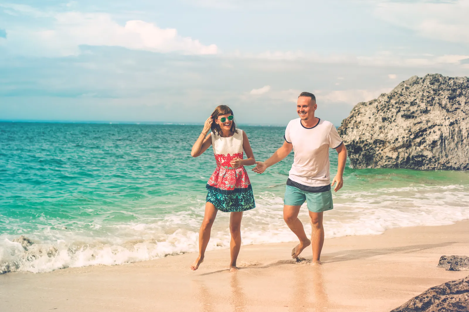 The Takeaway (Happy young honeymoon couple having fun on the beach. Ocean, tropical vacation on Bali island, Indonesia., CC BY 2.0)