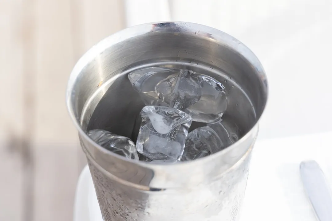 Dumping Ice Directly Into an Unwrapped Bucket (Image Credits: Unsplash)