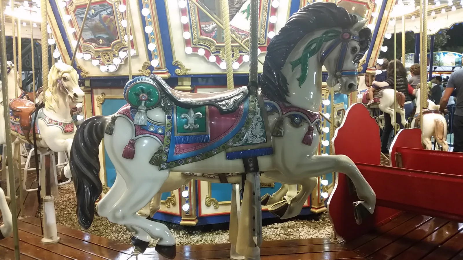 What Riding an Antique Carousel Actually Means (Michel Curi, Flickr, CC BY 2.0)