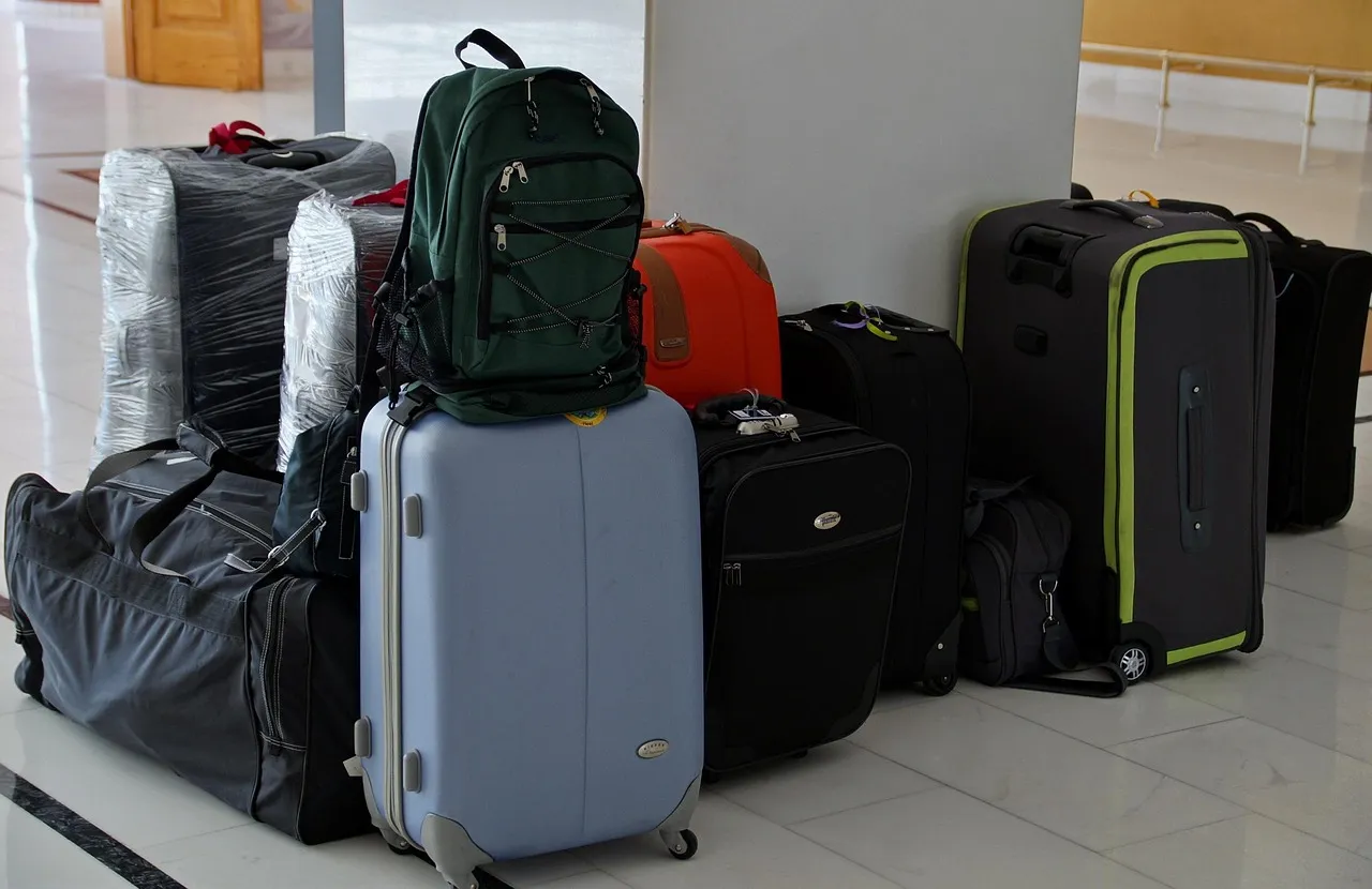 Layer One: Shoes and Heavy Items Go in First, Near the Wheels (Image Credits: Pixabay)
