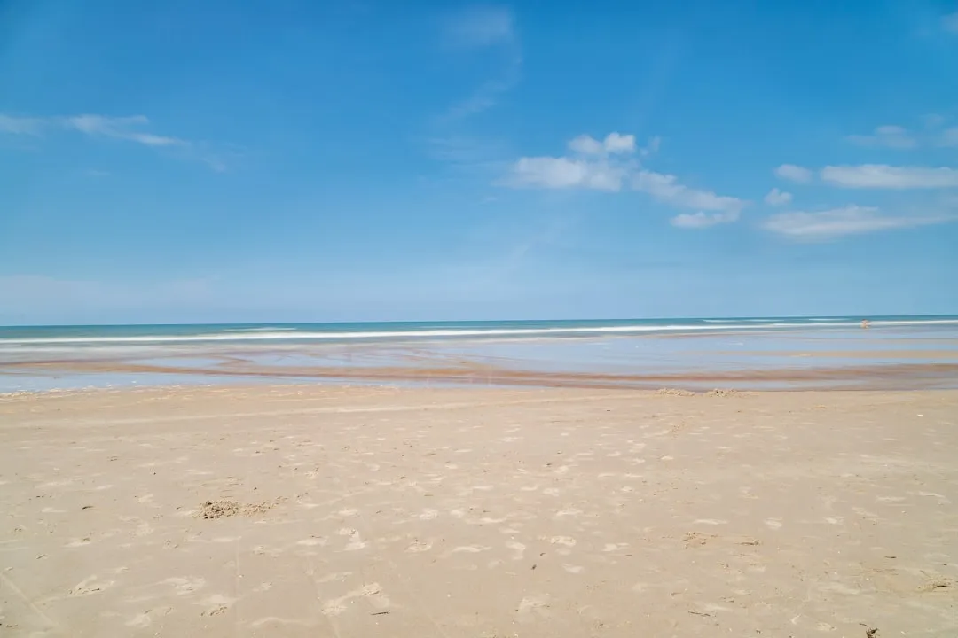 A Sheltered Stretch of Sand (Image Credits: Unsplash)