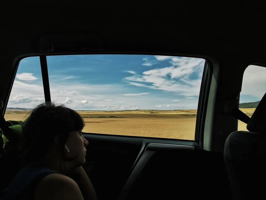 Facing the Window, Turned Away: The Introspective Wanderer (Image Credits: Unsplash)