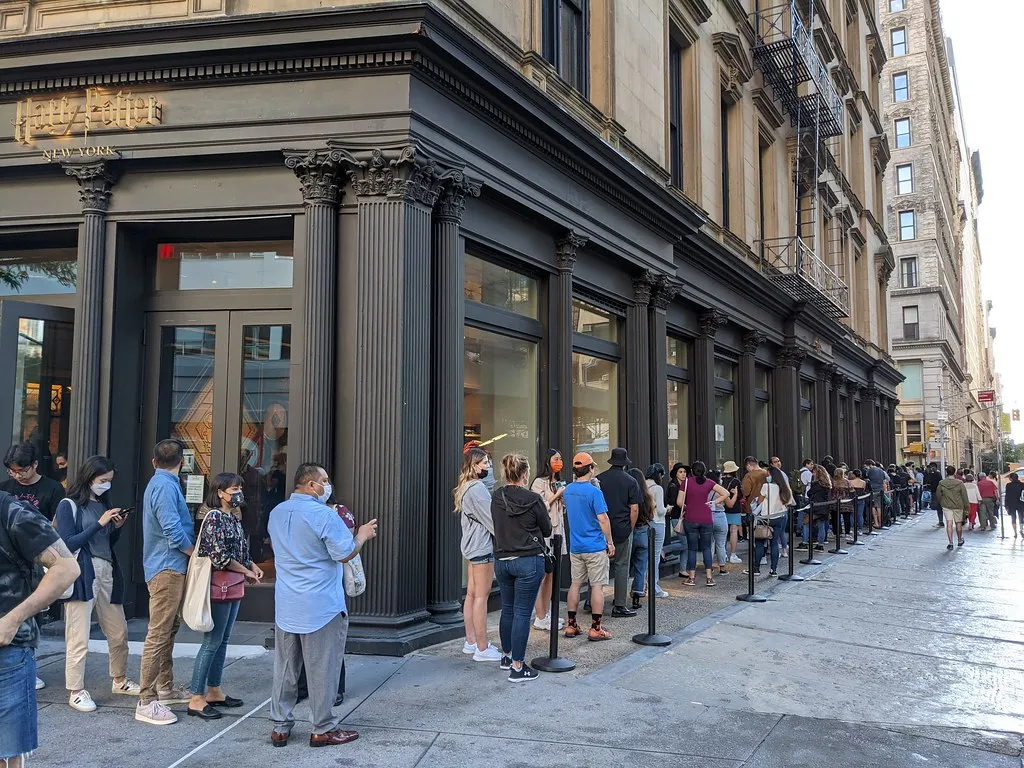 Standing "In Line" vs. Standing "On Line" (edenpictures, Flickr, CC BY 2.0)