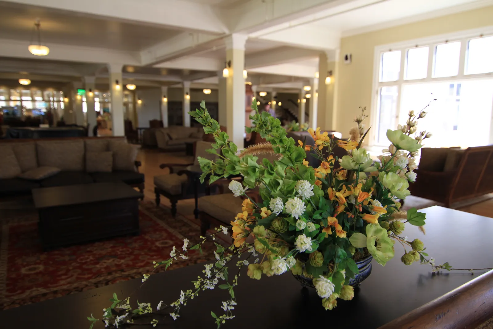 Color Choice Is a Deliberate Mood Strategy (Lake Hotel, flowers in the lobby, Public domain)
