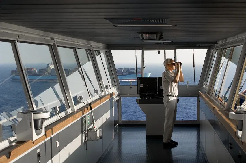 Ship Time Operates on Its Own Clock (Captain on the bridge of Edith Maersk, CC BY-SA 2.0)