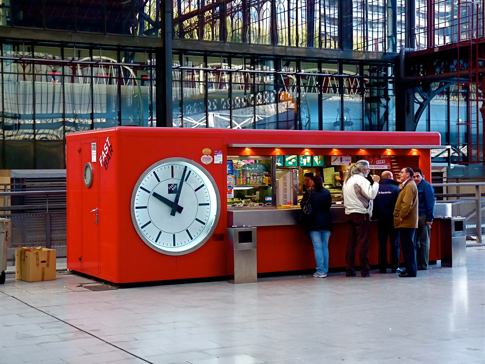 The Repeat Purchaser: When the Terminal Becomes a Loop (Flickr: A Quick Snack! Fast Bar Clock in the Principe Pío Station in Madrid Spain, CC BY 2.0)